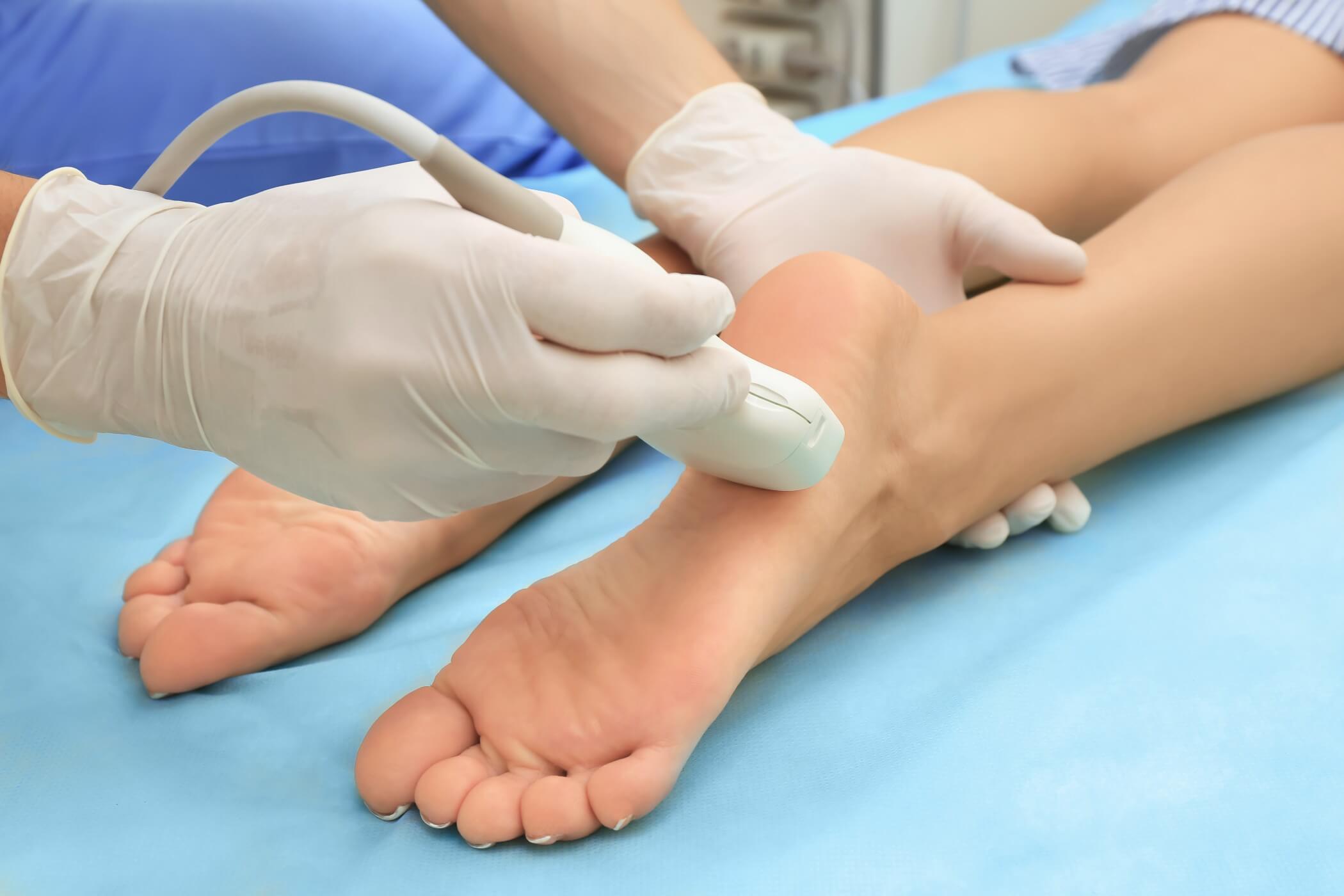 Doctor Checking Boys Foot